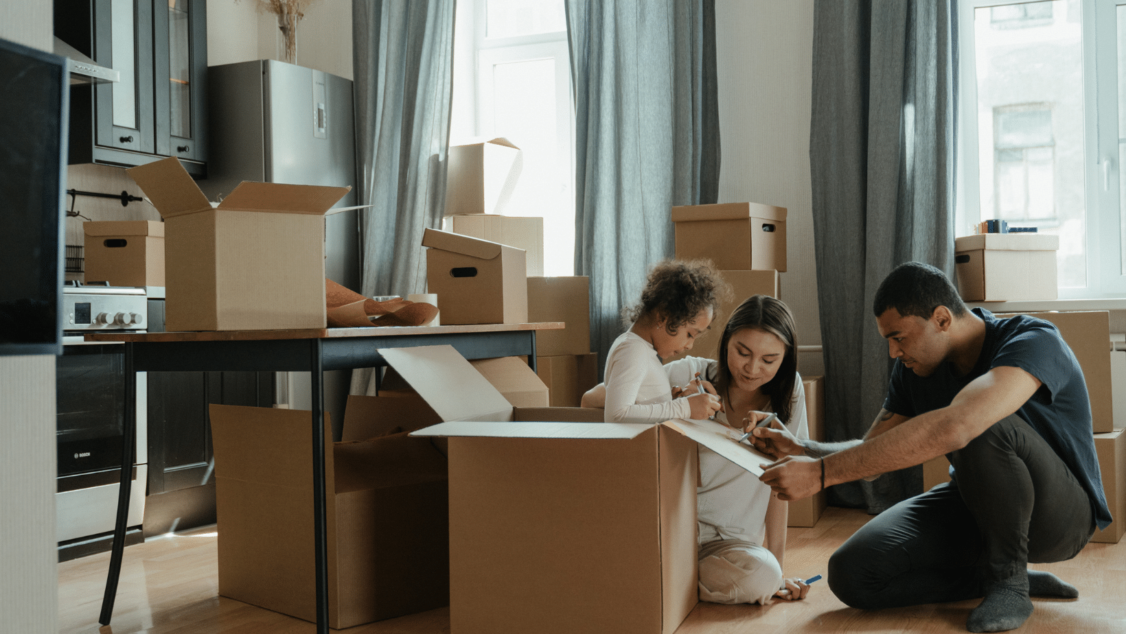 father and mother coloring on box with daughter