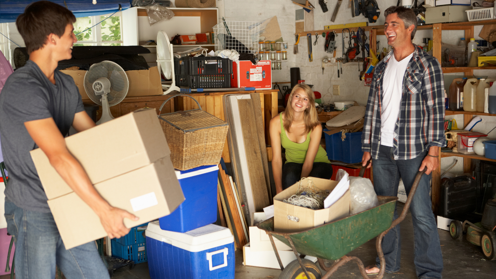 woman sitting in the middle of a messy garage
