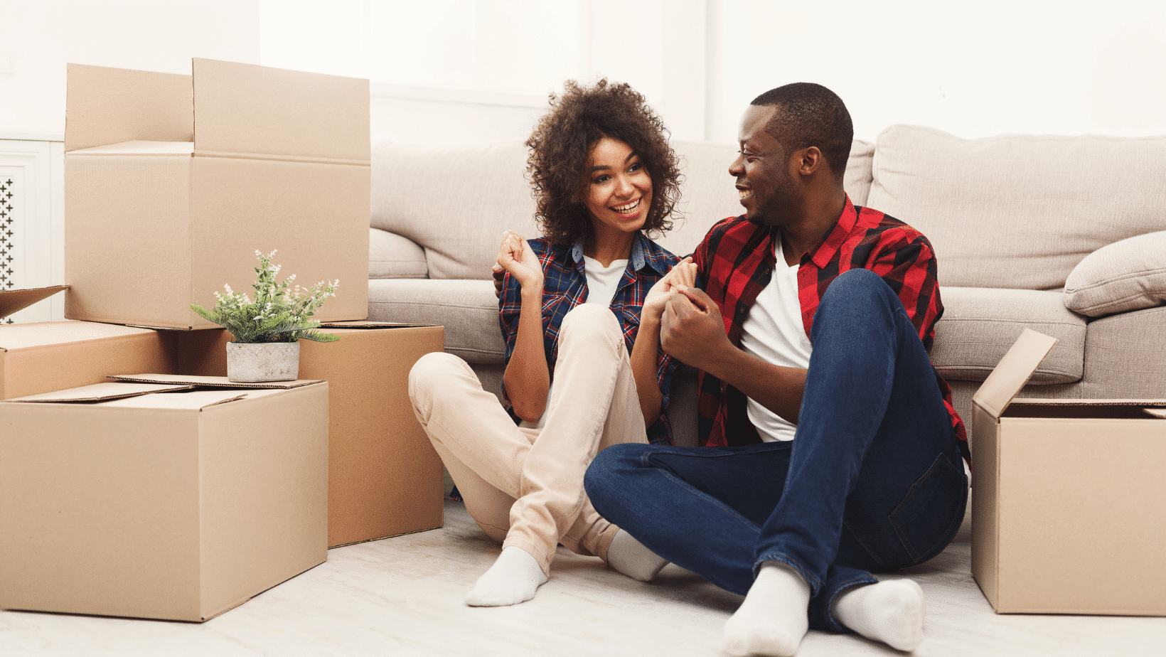 couple happy near moving boxes