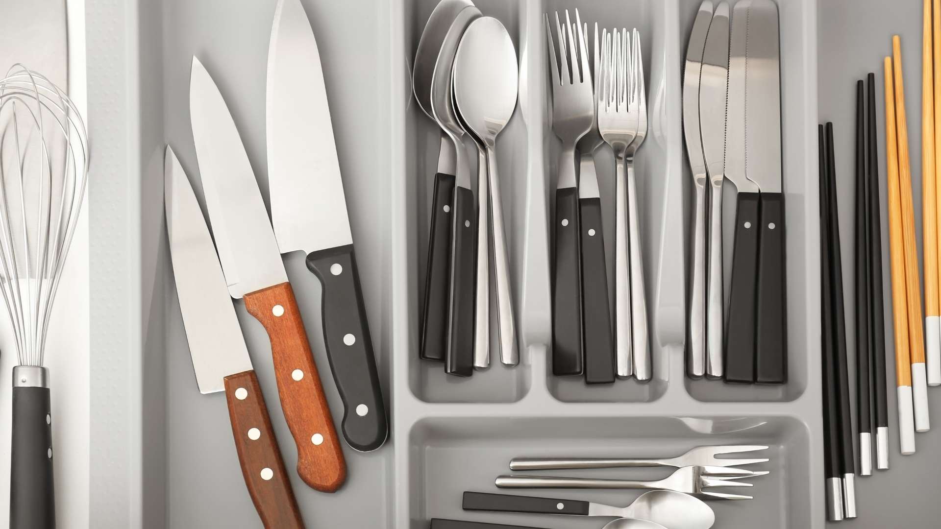 silverware in a tray located in a drawer